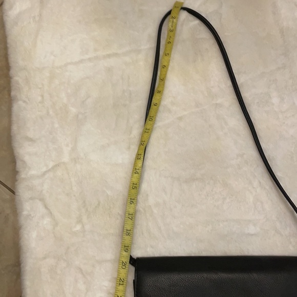H & M black crossbody with bold gold chain front accent. - Picture 11 of 11